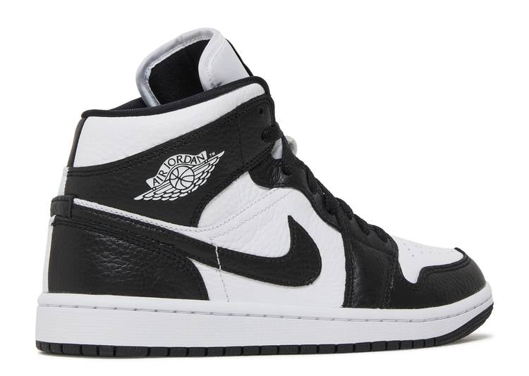 nike mid top black and white